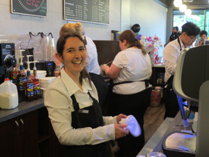 Amanda Kim, employment specialist for posAbilities employment service, smiles behind the counter at Joe's Table Café.    