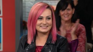 A woman with pink hair 